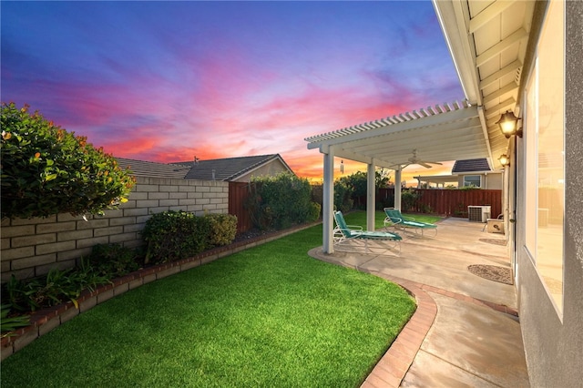 yard at dusk featuring cooling unit, a patio area, and a pergola