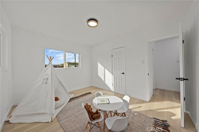 rec room featuring light hardwood / wood-style floors