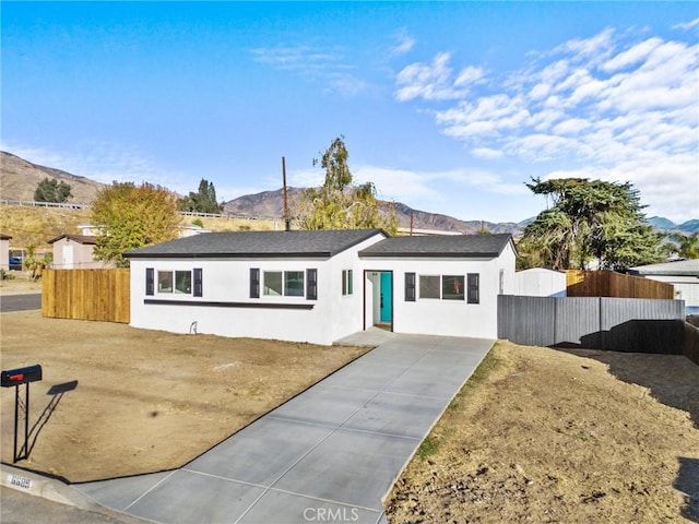 ranch-style house featuring a mountain view