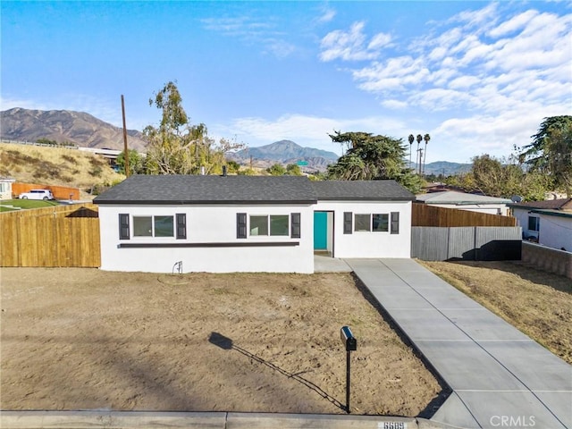 ranch-style home with a mountain view