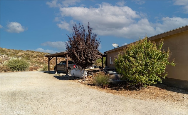 view of property exterior featuring a carport