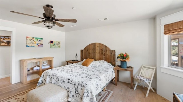 bedroom featuring ceiling fan and light hardwood / wood-style flooring