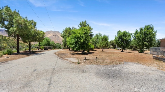 view of street featuring a mountain view and a rural view