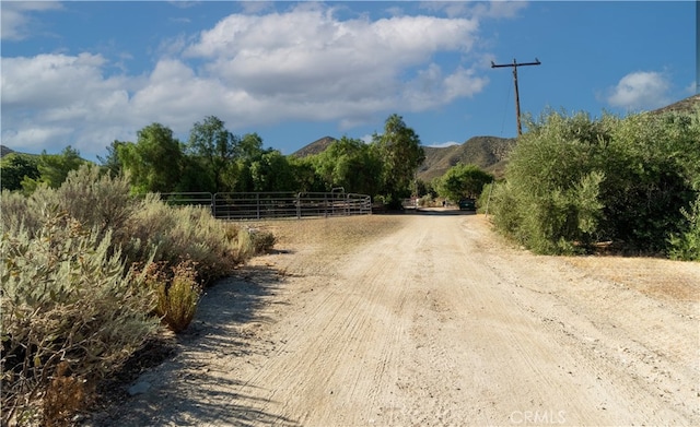 view of street with a mountain view and a rural view