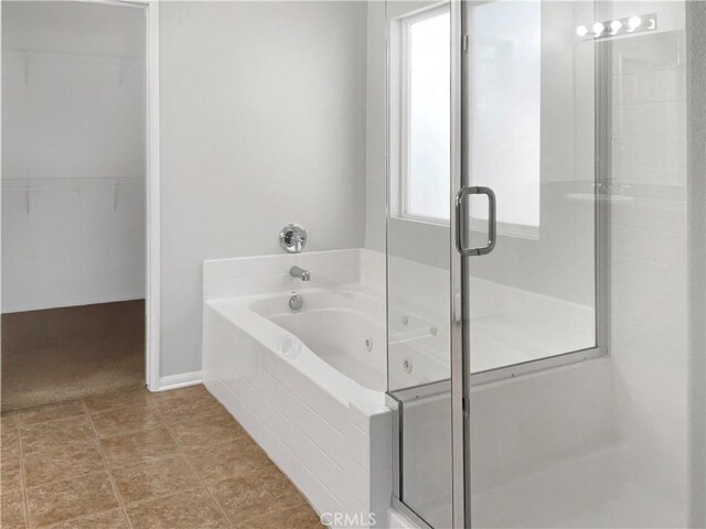 bathroom with separate shower and tub