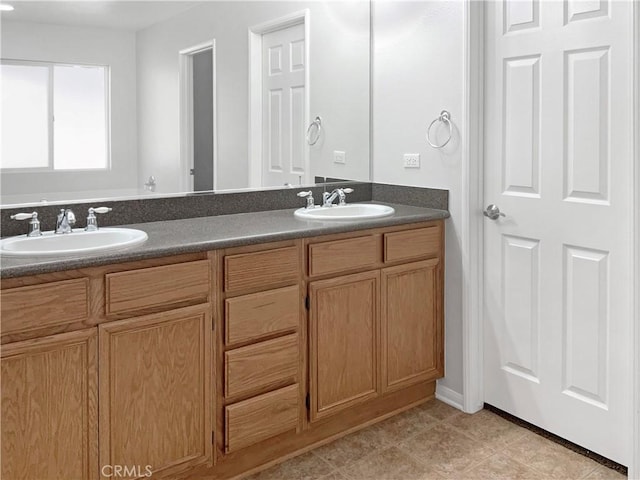 bathroom featuring tile patterned flooring and vanity