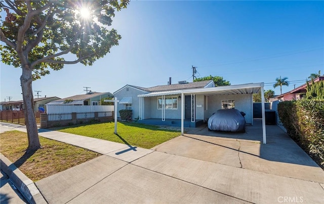 single story home featuring a front yard and a carport