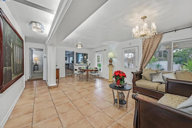 living room featuring a notable chandelier and light tile patterned flooring