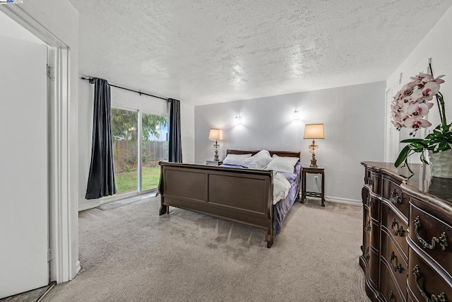 carpeted bedroom with a textured ceiling