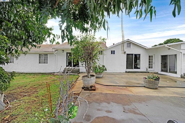 rear view of property with a patio area