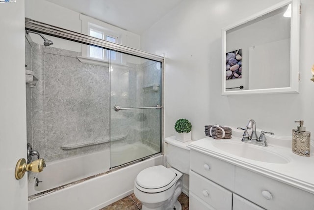 full bathroom featuring tile patterned flooring, vanity, toilet, and enclosed tub / shower combo