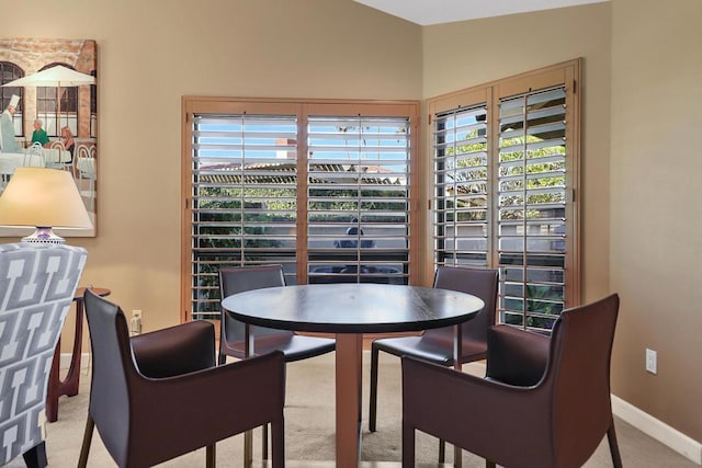 dining room with light carpet