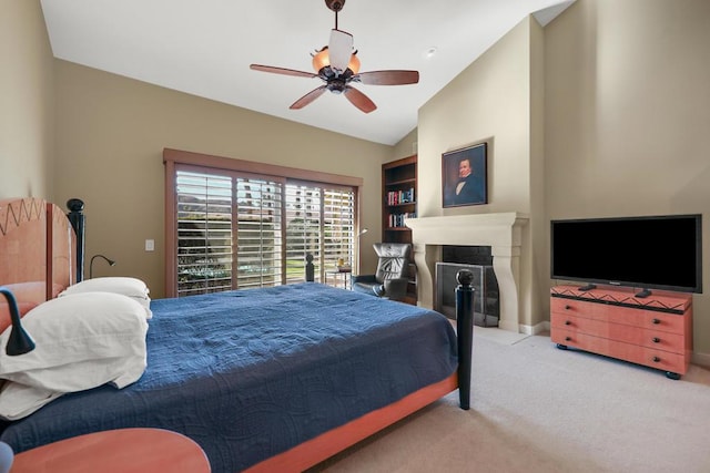 carpeted bedroom with ceiling fan and lofted ceiling