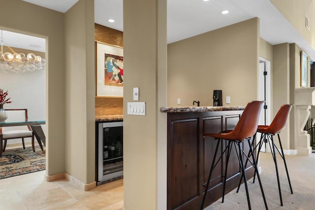 bar with light tile patterned floors, wine cooler, and tasteful backsplash