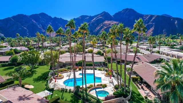 birds eye view of property featuring a mountain view