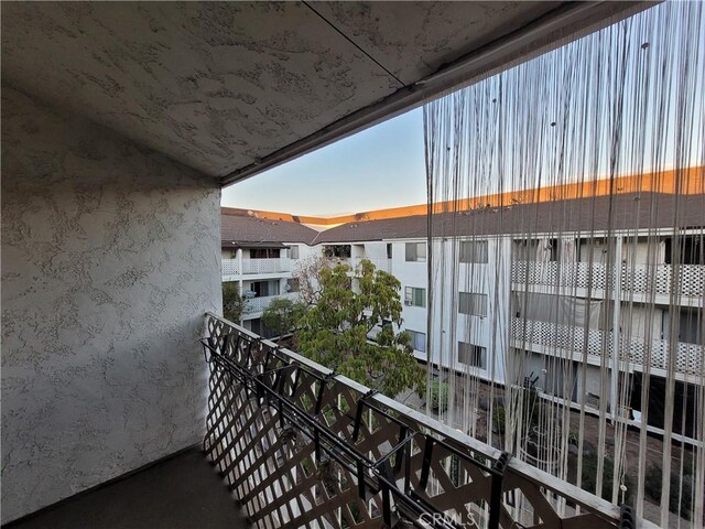 view of balcony at dusk