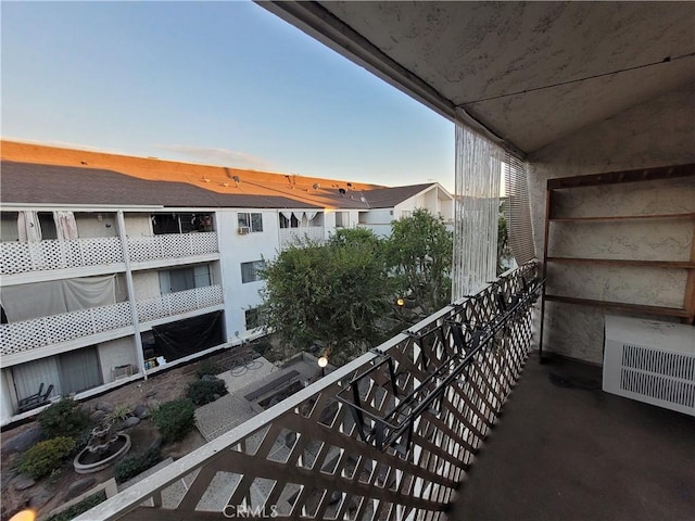 view of balcony at dusk