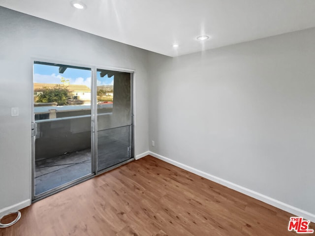 unfurnished room featuring wood-type flooring