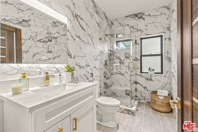 bathroom featuring vanity, a shower with shower door, tile walls, and toilet