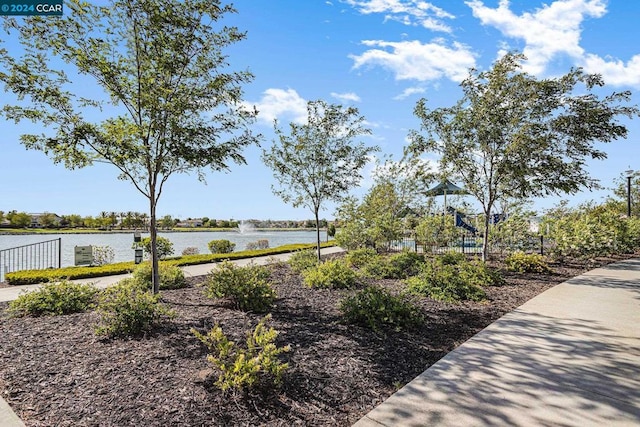 view of home's community with a water view