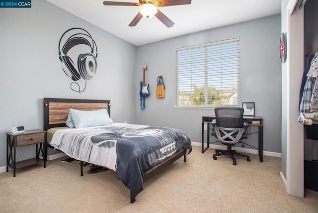 carpeted bedroom with ceiling fan