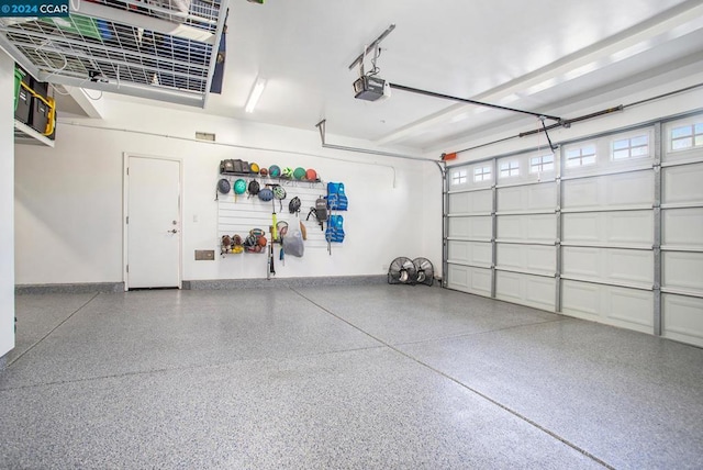 garage featuring a garage door opener