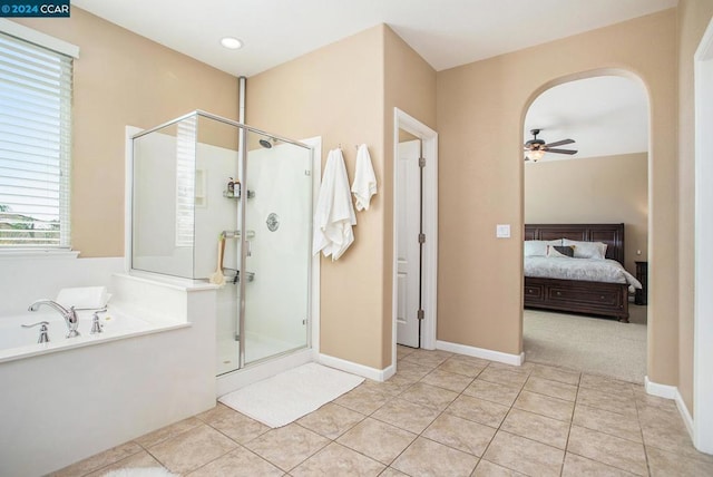 bathroom featuring ceiling fan, tile patterned flooring, and shower with separate bathtub