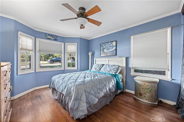 bedroom with ceiling fan, dark wood-type flooring, and ornamental molding