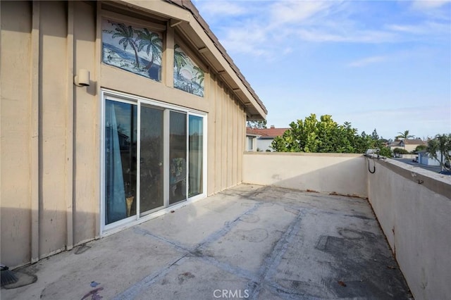 view of side of home with a patio