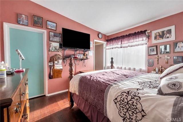 bedroom with dark hardwood / wood-style floors