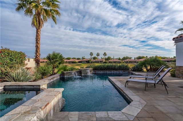 view of swimming pool featuring a patio area and pool water feature