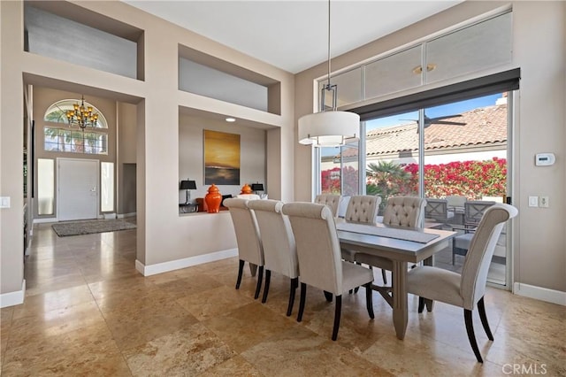 dining space with a notable chandelier