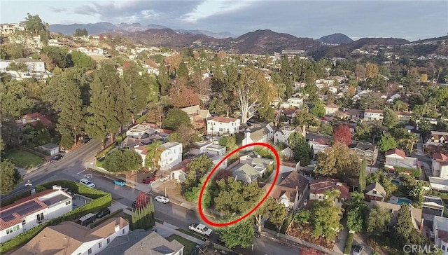 birds eye view of property featuring a mountain view