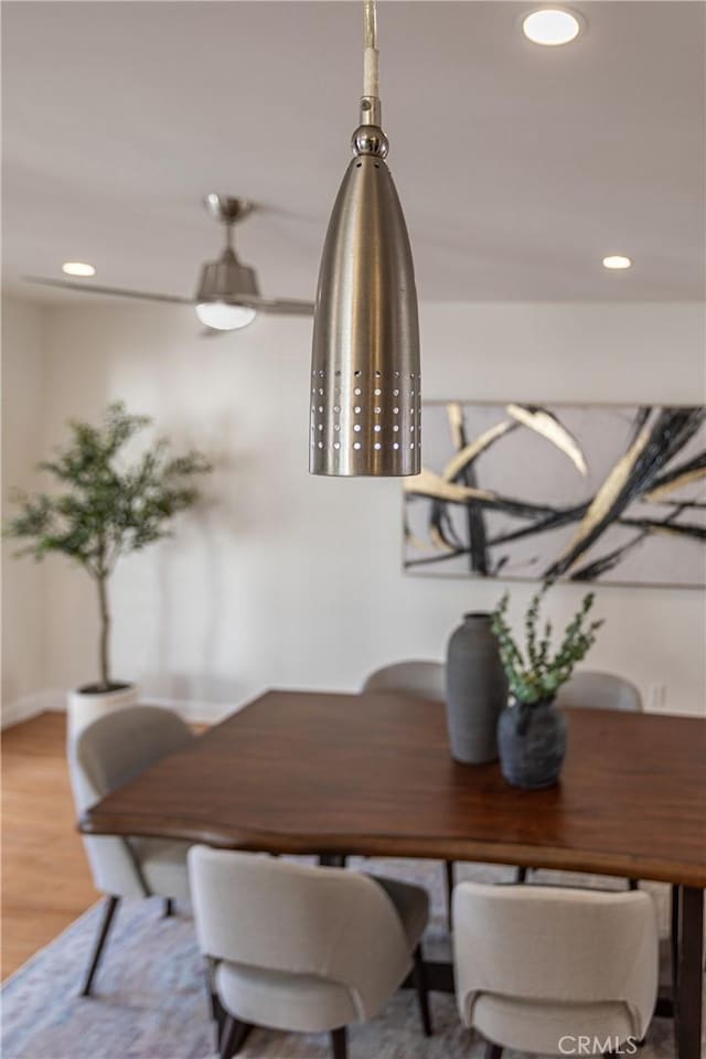 dining space featuring wood-type flooring