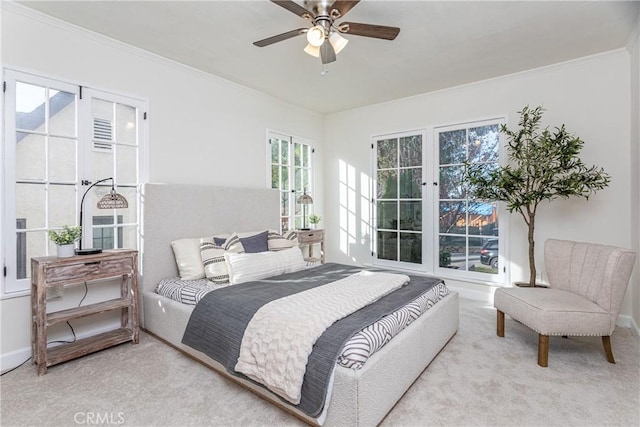 bedroom with ceiling fan, light colored carpet, and ornamental molding