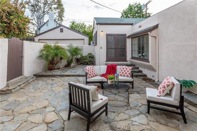 view of patio / terrace featuring an outbuilding and an outdoor hangout area