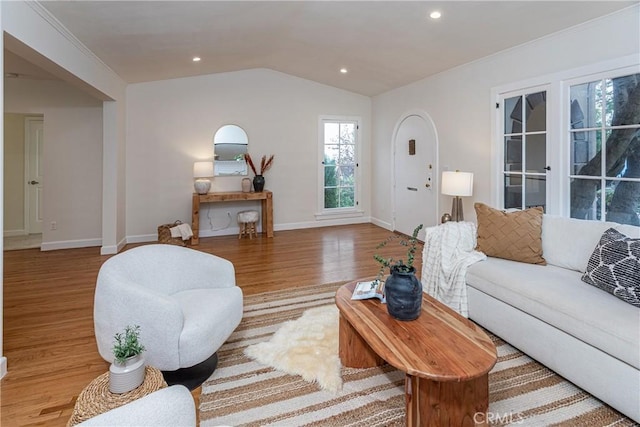 living room featuring hardwood / wood-style floors and lofted ceiling