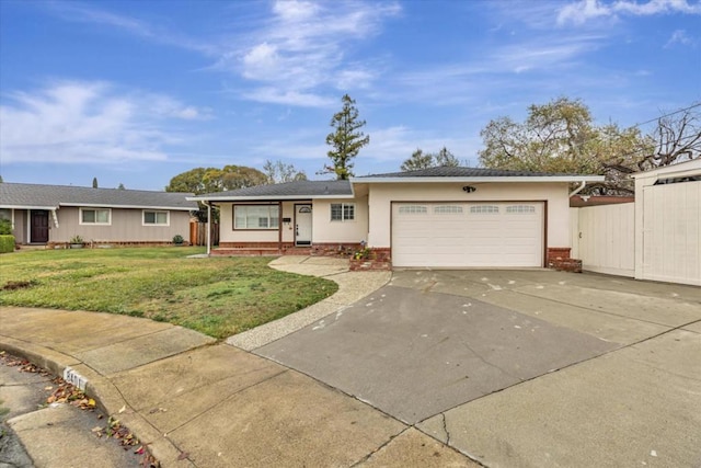 ranch-style house featuring a garage and a front lawn