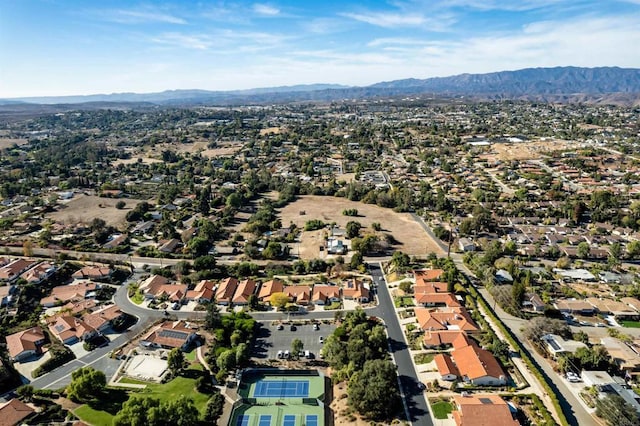 birds eye view of property with a mountain view