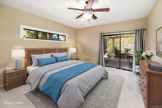 carpeted bedroom with ceiling fan and access to exterior