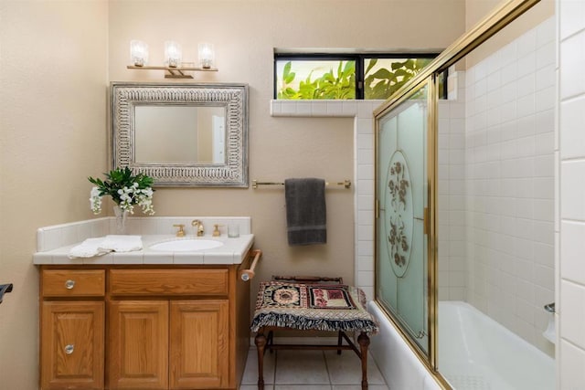 bathroom with shower / bath combination with glass door, vanity, and tile patterned flooring