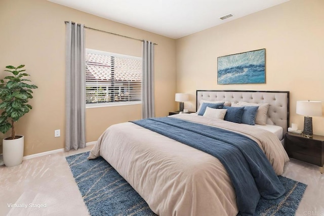 bedroom featuring light colored carpet