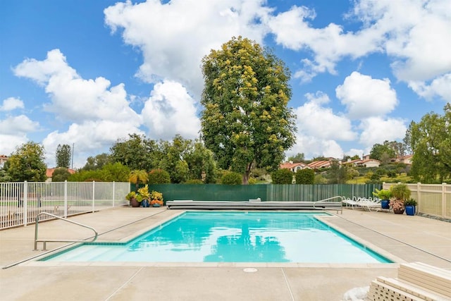 view of swimming pool featuring a patio area