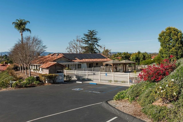 view of front of property with solar panels