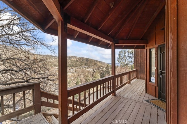 wooden terrace featuring a mountain view