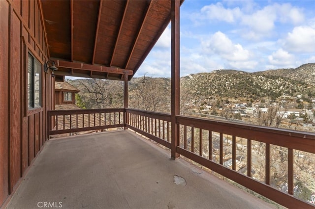 wooden deck with a mountain view