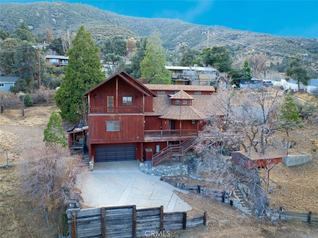 drone / aerial view featuring a mountain view