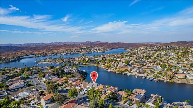 aerial view featuring a water and mountain view