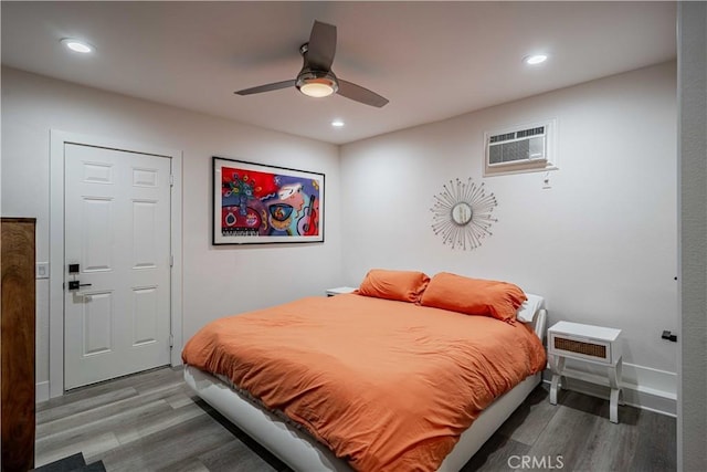 bedroom featuring ceiling fan and hardwood / wood-style floors