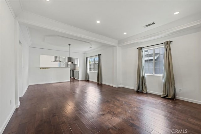 unfurnished living room featuring dark hardwood / wood-style floors and crown molding